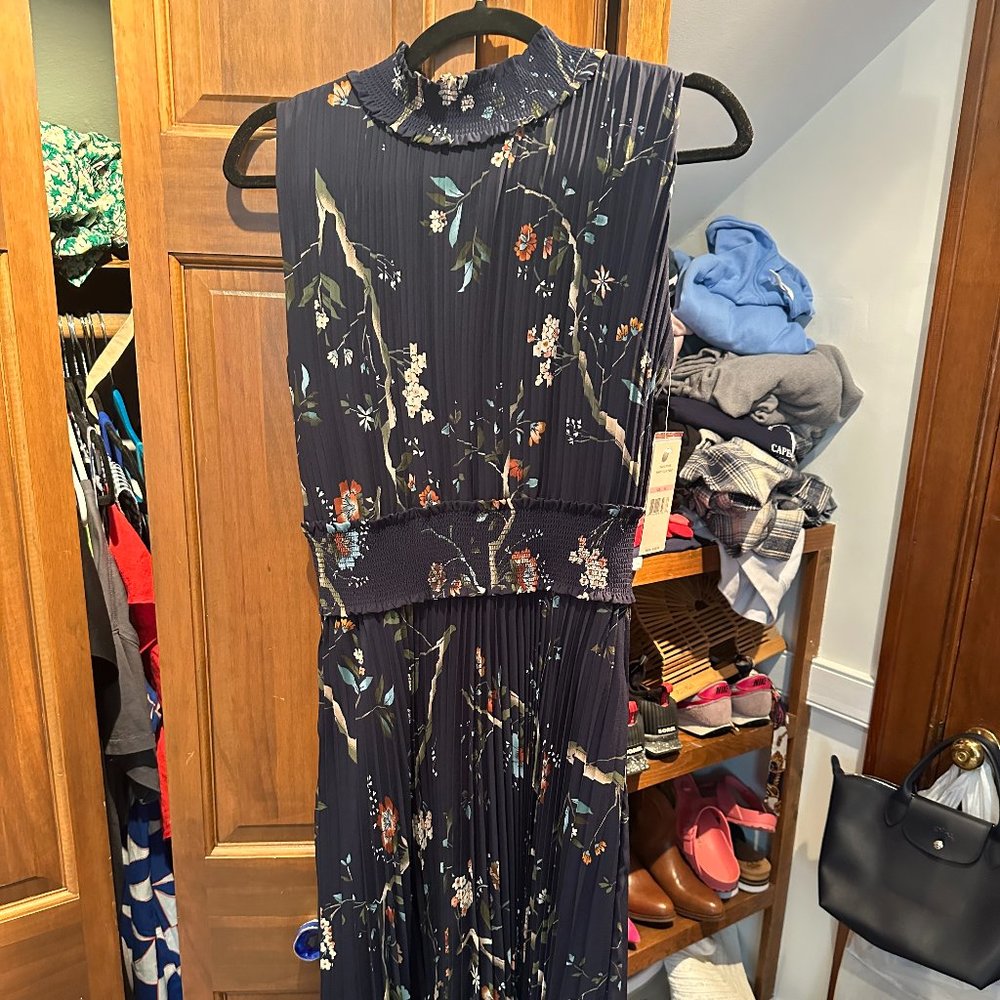 Navy Blue Floral, sleeveless dress with mock collar.